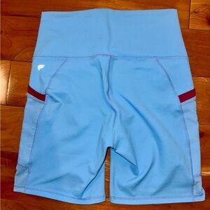Fabletics PowerHold Light Blue Biker Shorts with Accents